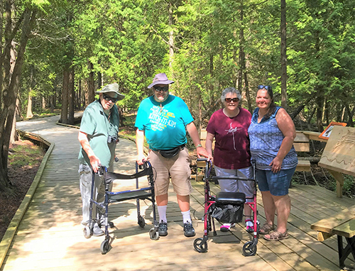 A group of four people using the Boardwalk