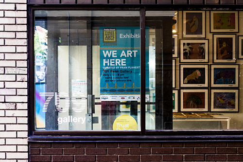 Door to a gallery space reading We Art Here