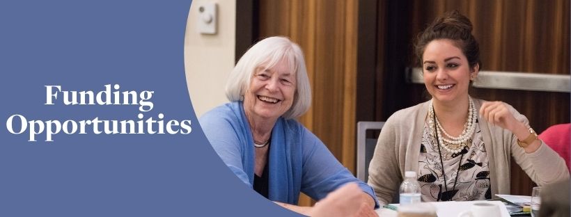 Banner- Funding Opportunities - with photo of two women smiling across a table